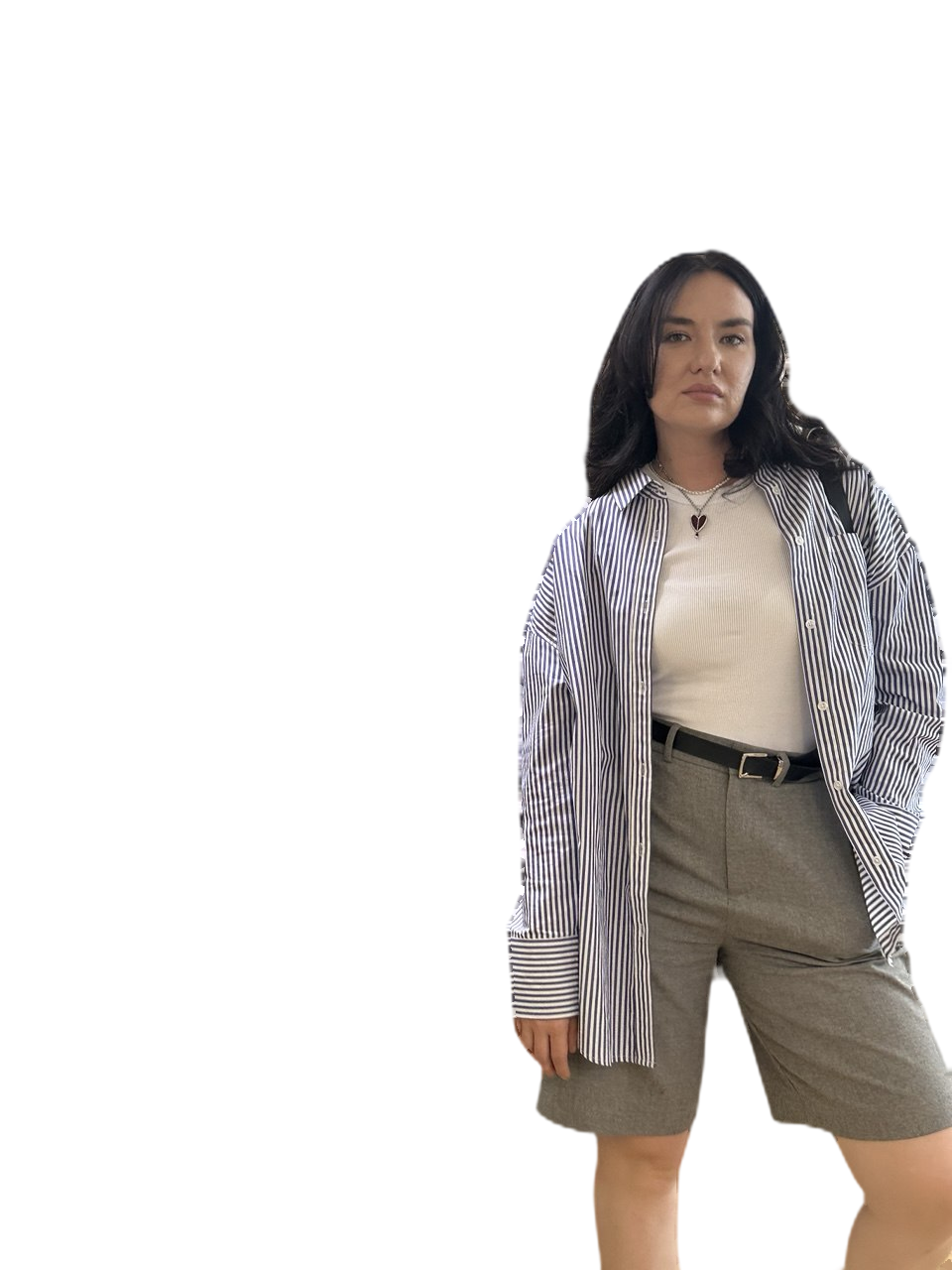 Dina Mi in a striped overshirt and gray tailored shorts