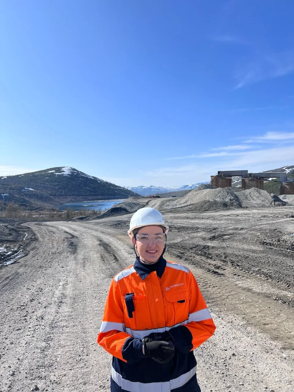Dina Mi wearing safety equipment at a mining site